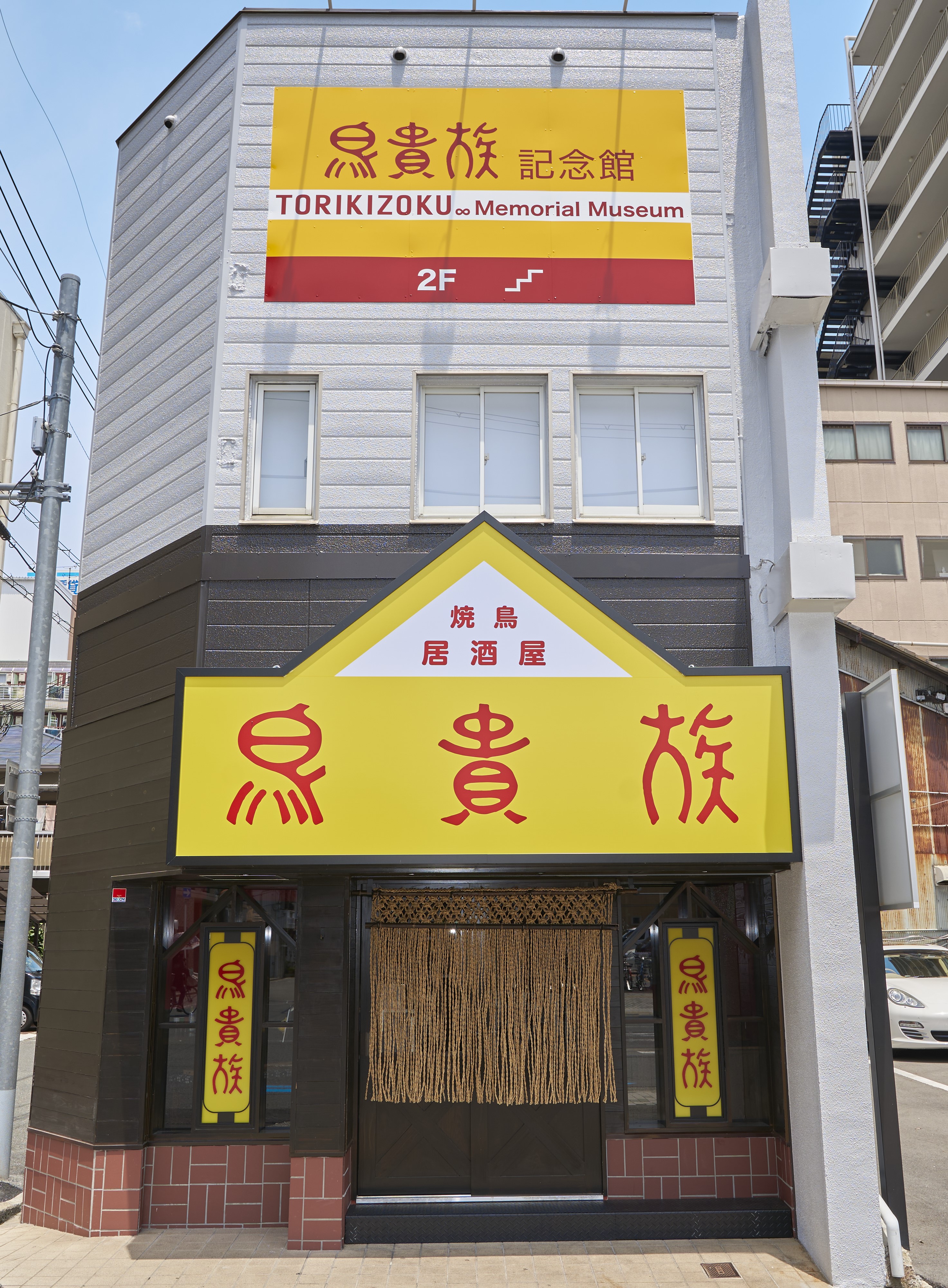 道頓堀に「万博開催1000日前」フラッグ 街路灯に掲げるサイネージも万博仕様に -